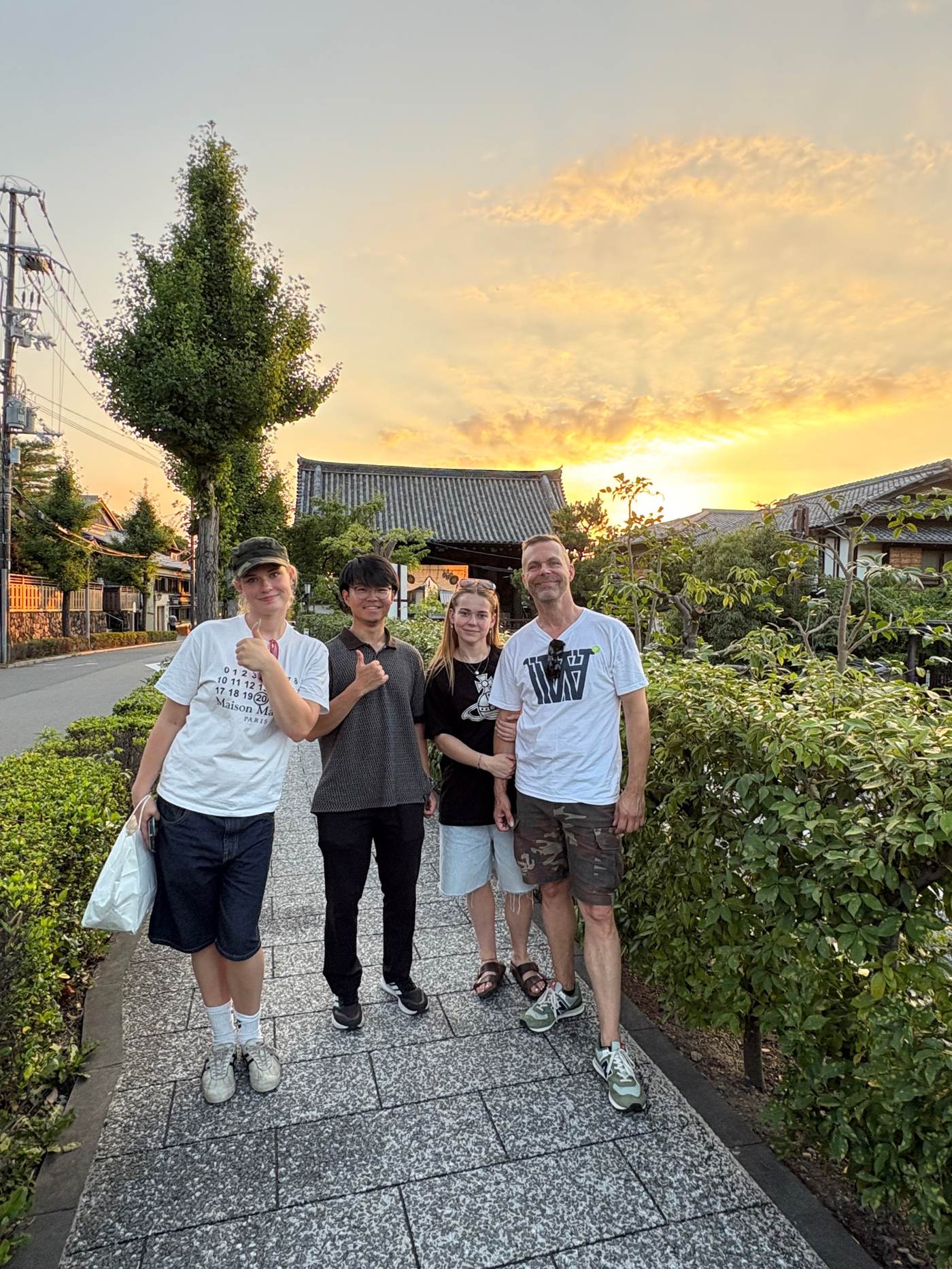 Guests and guide at sunset in Kyoto